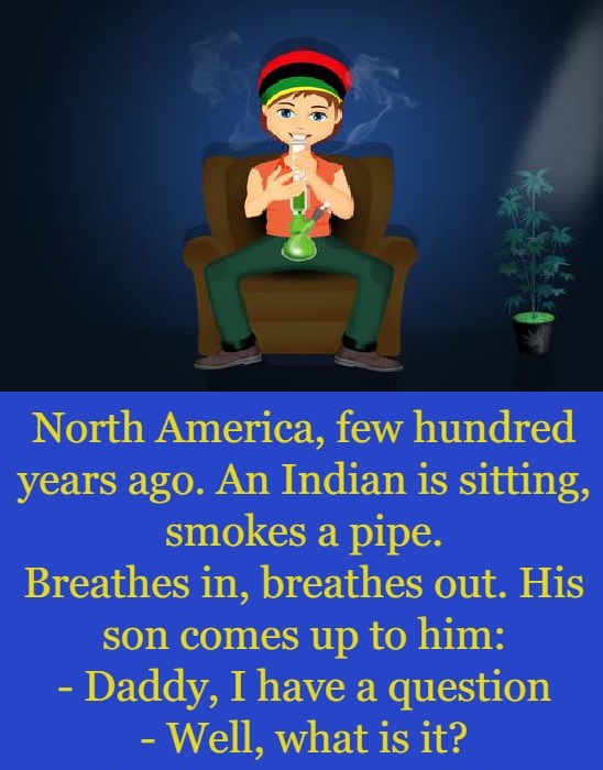 Indian guy is sitting smokes a pipe