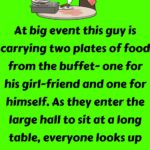 At big event this guy is carrying two plates of food